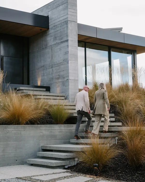 Two agents walking up to a listing